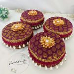 A set of five red round laddu boxes perfect for storing shagun laddus and make wonderful gifts