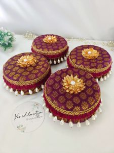 A set of five red round laddu boxes perfect for storing shagun laddus and make wonderful gifts