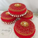 A set of five red round laddu boxes perfect for storing shagun laddus and make wonderful gifts