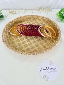 gold platter with intricate designs and a finely detailed border, ideal for Bangle Chuda ceremonies presenting bangles and chuda, using it as a decorative home piece, or presenting gifts at weddings and festive events, this platter adds a touch of elegance to wedding occasion