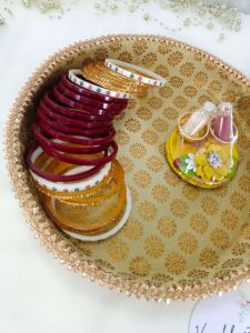 Intricate gold-patterned platter with a finely detailed border deal for ceremonial use presenting bangles and chuda ceremony platter celebrations with this elegant and versatile platter