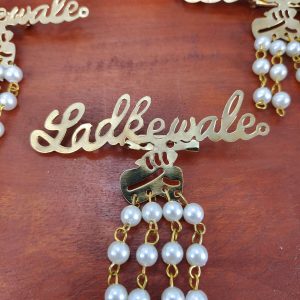 pearl-adorned Ladkewale Gold Plated Brooches. The brooch features a delicate arrangement of pearls on a classic design, ideal for baaratis and groom side badges