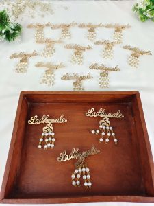 a charming Ladkewale brooch, embellished with pearls. The brooch is elegantly designed, making it an ideal wedding favor or coat accessory for groom side badges and baaratis