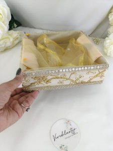 Golden Shagun Embroidery Tray has intricate lace detailing and is ideal for weddings and special occasions. This beautifully crafted tray features delicate lace accents, making it perfect for nikah ceremonies, wedding favors, return gifts, and bridal showers.