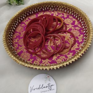 bangle ceremony platter in vibrant pink with intricate gold floral patterns and delicate pearl detailing for wedding functions, bridal showers, or engagement ceremonies