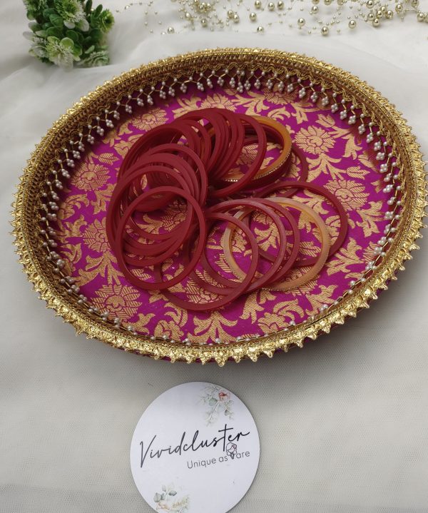 bangle ceremony platter in vibrant pink with intricate gold floral patterns and delicate pearl detailing for wedding functions, bridal showers, or engagement ceremonies