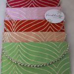 Set of colorful shagun cash envelopes adorned with gold embroidery and pearls, ideal for wedding favors and bridal showers