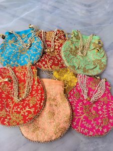 embroidery potli bags are designed to make your wedding giveaways truly memorable. Available in green, yellow, pink, and beige, these bags are perfect for wedding favors, bride's wedding favors, and bridesmaid gifts. The intricate embroidery adds a traditional touch, making them ideal for Nikah ceremonies and other wedding accessories.