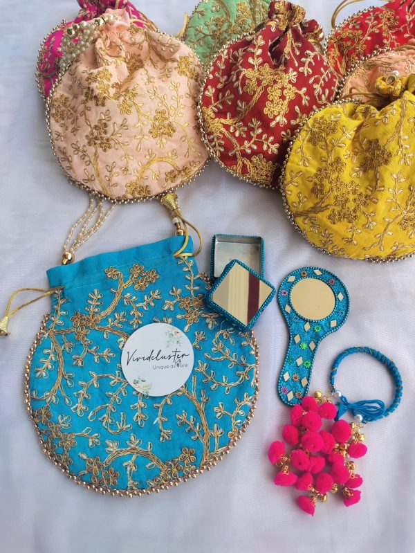 collection of beautifully embroidered potli bags, perfect for weddings and Nikah ceremonies. These bags, adorned with intricate gold threadwork, come in vibrant colors like green, yellow, pink, and beige. Ideal as wedding favors, bride's wedding favors, bridesmaid gifts, and wedding accessories