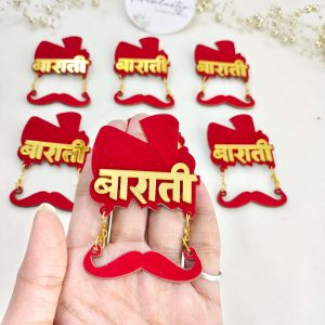 a red and gold Barati acrylic brooch with a mustache design, perfect for groom's side badges, wedding favors, and groomsmen gifts