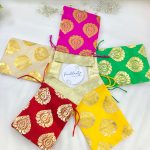 tissue potlis with rich golden prints, perfect for wedding favors, birthday parties, and gift hampers