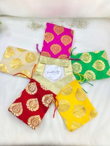 tissue potlis with rich golden prints, perfect for wedding favors, birthday parties, and gift hampers