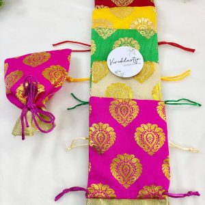 Traditional tissue potlis in multiple colors with gold motifs, ideal for wedding giveaways and special celebrations