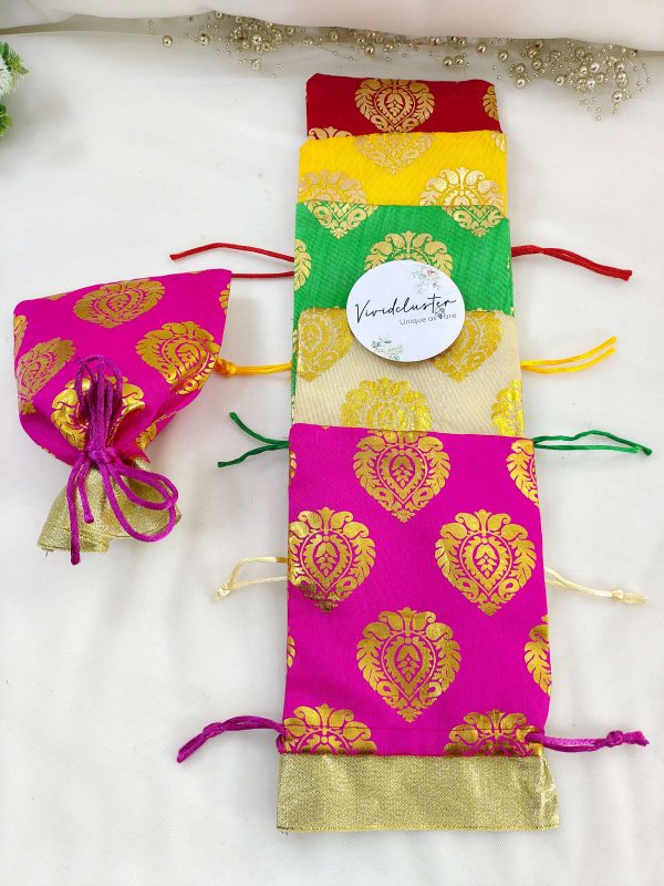 Traditional tissue potlis in multiple colors with gold motifs, ideal for wedding giveaways and special celebrations