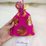 Beautifully crafted tissue wedding potlis featuring golden designs, perfect for nikah ceremonies and gift hampers