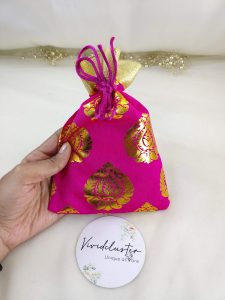 Beautifully crafted tissue wedding potlis featuring golden designs, perfect for nikah ceremonies and gift hampers