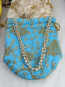 embroidery design wedding potli bags with golden accents, perfect for wedding favors, bridesmaid gifts, and Nikah ceremony accessories