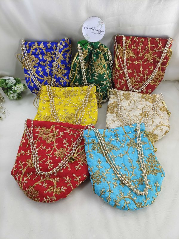 Colorful embroidery wedding potli bags with embroidery golden designs, suitable for wedding favors, bridesmaid gifts, and wedding accessories. Perfect for Nikah ceremonies.