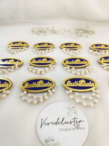 pearl-adorned Ladkewale brooch. The brooch features a delicate arrangement of pearls on a classic design, ideal for baaratis and groom side badges.