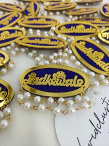 a sophisticated Ladkewale brooch with pearl embellishments. The brooch features a refined design with delicate pearls, making it an ideal wedding favor and coat accessory