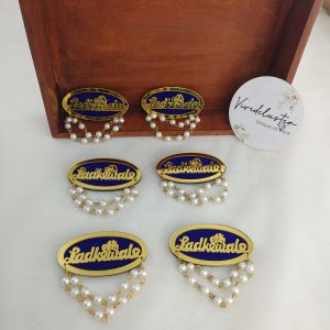 Ladkewale brooch adorned with pearls. The brooch is designed to enhance wedding attire, serving as a wedding favor, baarati brooch, and coat accessory.