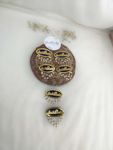 an elegant Ladkewale brooch with delicate pearl detailing. Ideal for baaratis, this brooch functions as a wedding favor, groom side badge, and coat accessory, adding sophistication to Nikah ceremony attire