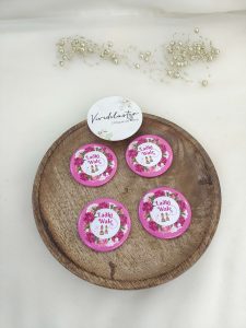 displaying a round, pink and white brooch with the words "Ladki Wale" and a delicate flower design for the bride's side. Perfect for baraat day, nikah ceremonies, or as a unique wedding favor