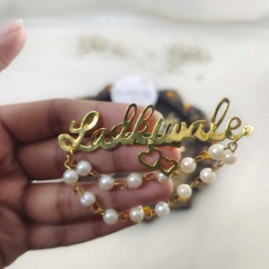 Ladkiwale brooch with pearl and bead embellishments for wedding attire accessories, lehenga accessories, and bridesmaids gifts.