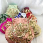 Beautifully crafted Gota Potlis with intricate gold embroidery and pearl handles, ideal for wedding favors and bridesmaid gifts.