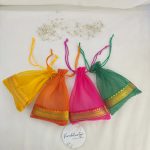 A colorful collection of tissue potli bags, perfect for wedding favors, nikah ceremonies, and special occasions. These bags are ideal for gift hampers, birthdays, and anniversaries