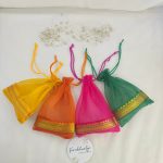 beautifully crafted tissue potli bags in various colors, suitable for wedding favors, nikah ceremonies, and anniversary gifts