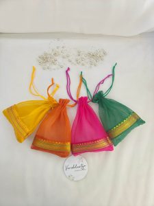 beautifully crafted tissue potli bags in various colors, suitable for wedding favors, nikah ceremonies, and anniversary gifts