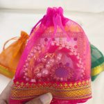 A collection of colorful tissue potli bags, perfect for wedding gifts, nikah ceremonies, and birthday celebrations