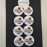 several white "TEAM GROOM" pins with a brown top hat and mustache design, Suitable for groomsmen brooches at weddings and nikah ceremonies.
