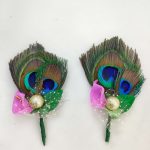 wedding brooch with a peacock feather, pink flower, and golden ball, suitable for nikah ceremonies and wedding attire