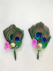 wedding brooch with a peacock feather, pink flower, and golden ball, suitable for nikah ceremonies and wedding attire