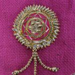 A handcrafted pink jute potli bag with detailed golden Gota embellishments and a decorative handle, perfect for wedding giveaways and nikah ceremonies.
