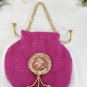 A vibrant pink Gota Jute Potli bag featuring intricate golden embellishments and a decorative handle, ideal for wedding favors and gift hampers, perfect for nikah ceremonies and bridesmaids