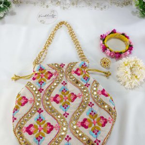 embroidered potli bag, showcasing vibrant floral patterns in pink, yellow, and blue, accented with golden beads and sequins. The bag is cinched at the top with a golden drawstring, making it ideal for weddings, nikah ceremonies, and as a wedding favor, gift hamper