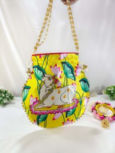 potli bag design featuring a calm white cow amidst vibrant lotus flowers and leaves, ideal for wedding giveaways and gift hampers