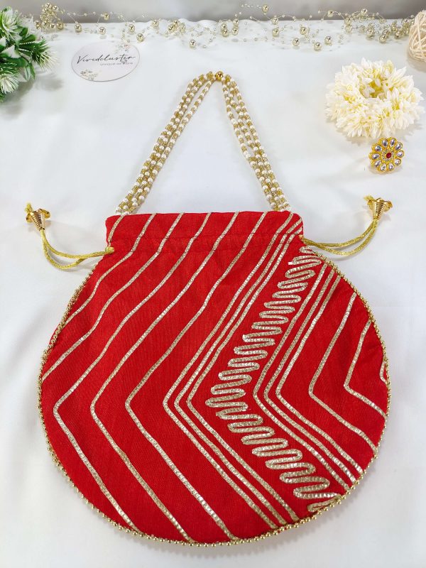 "Red Gota Potli bag with intricate gold detailing and pearl handles, ideal for weddings, nikah ceremonies, and bridal giveaways