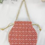 Beautifully designed Embroidery Wedding Potli with white patterns on a vibrant red fabric, perfect for wedding gifts, bridesmaid favors, or as a special accessory for the bride