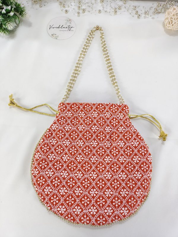 Embroidery Wedding Potlis with intricate white patterns on a rich red base, perfect for wedding favors, bridesmaid gifts, and nikah ceremony accessories
