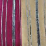 showcases elegant potli bags, designed with silver stripes on pink and peach backgrounds. These bags are an excellent choice for bridal accessories, bridesmaid gifts, or as wedding favors