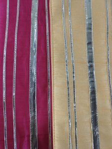 showcases elegant potli bags, designed with silver stripes on pink and peach backgrounds. These bags are an excellent choice for bridal accessories, bridesmaid gifts, or as wedding favors