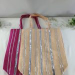 - Featured in this image are stylish potli bags, perfect for a bride’s wedding favors. The bags, available in pink and peach with silver stripes, are ideal for distributing small gifts