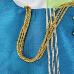 Blue and green potli bags with doll embellishments, designed for wedding favors, nikah ceremonies, and bridal shower presents