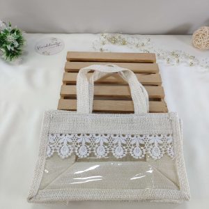 A beautifully crafted jute bag adorned with delicate lace, perfect for wedding favors, nikah ceremonies, and bridal shower gifts