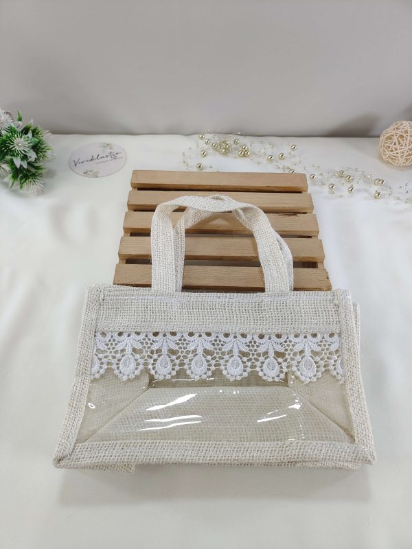 A beautifully crafted jute bag adorned with delicate lace, perfect for wedding favors, nikah ceremonies, and bridal shower gifts