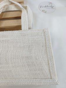 A natural jute potli bag with intricate lace detailing, designed to complement any wedding theme. Perfect for nikah ceremonies, bridal showers, and as a thoughtful bridesmaid gift